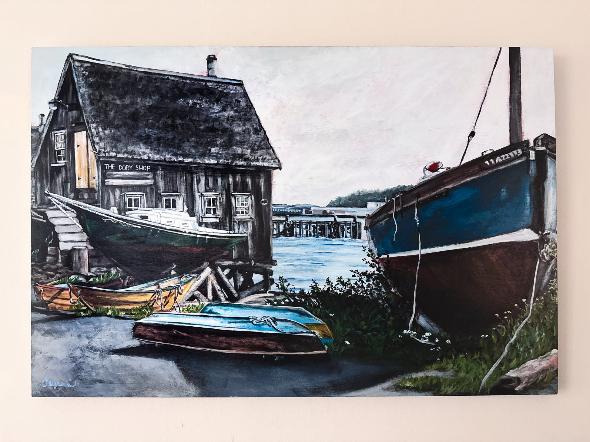 Acrylic painting on 24x36 birch gallery panel of The Dory Shop in Lunenburg, Nova Scotia. Featuring an overcast sky and colorful boats with the dock in the background.