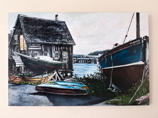 Acrylic painting on 24x36 birch gallery panel of The Dory Shop in Lunenburg, Nova Scotia. Featuring an overcast sky and colorful boats with the dock in the background. 